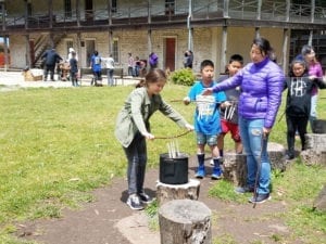 Students making traditional candles at Sanchez Adobe school program
