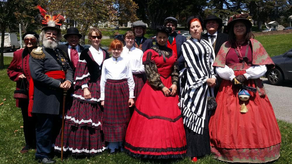 Group dressed in period Victorian clothing for Victorian Walking Day Tours at San Mateo County History Museum