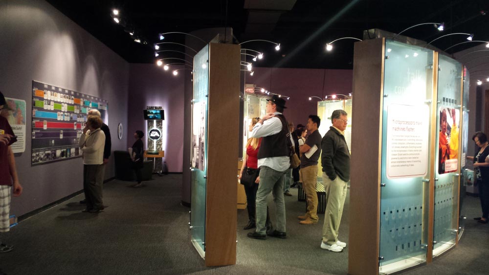 Visitors view the exhibit History Makers at the San Mateo County History Museum
