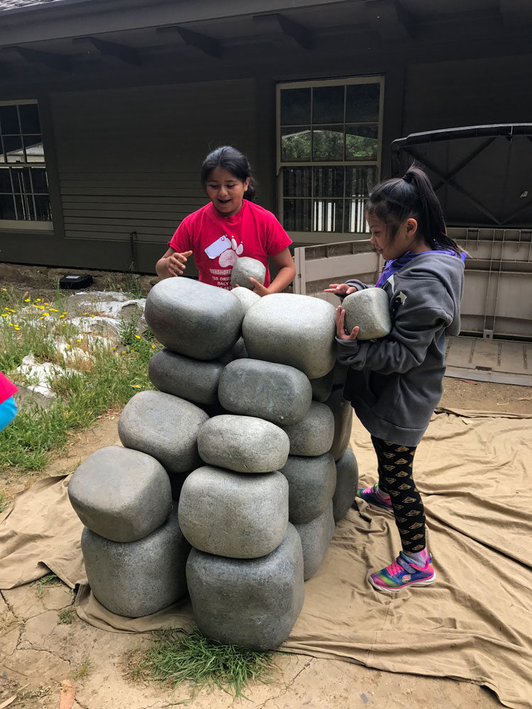 Students build a wall at the Folger Stable School Program
