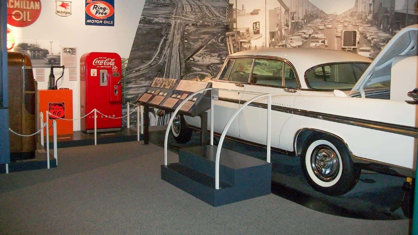 A display of a El Dorado and vintage auto memorabilia at the Journey to Work exhibit at the San Mateo County History Museum