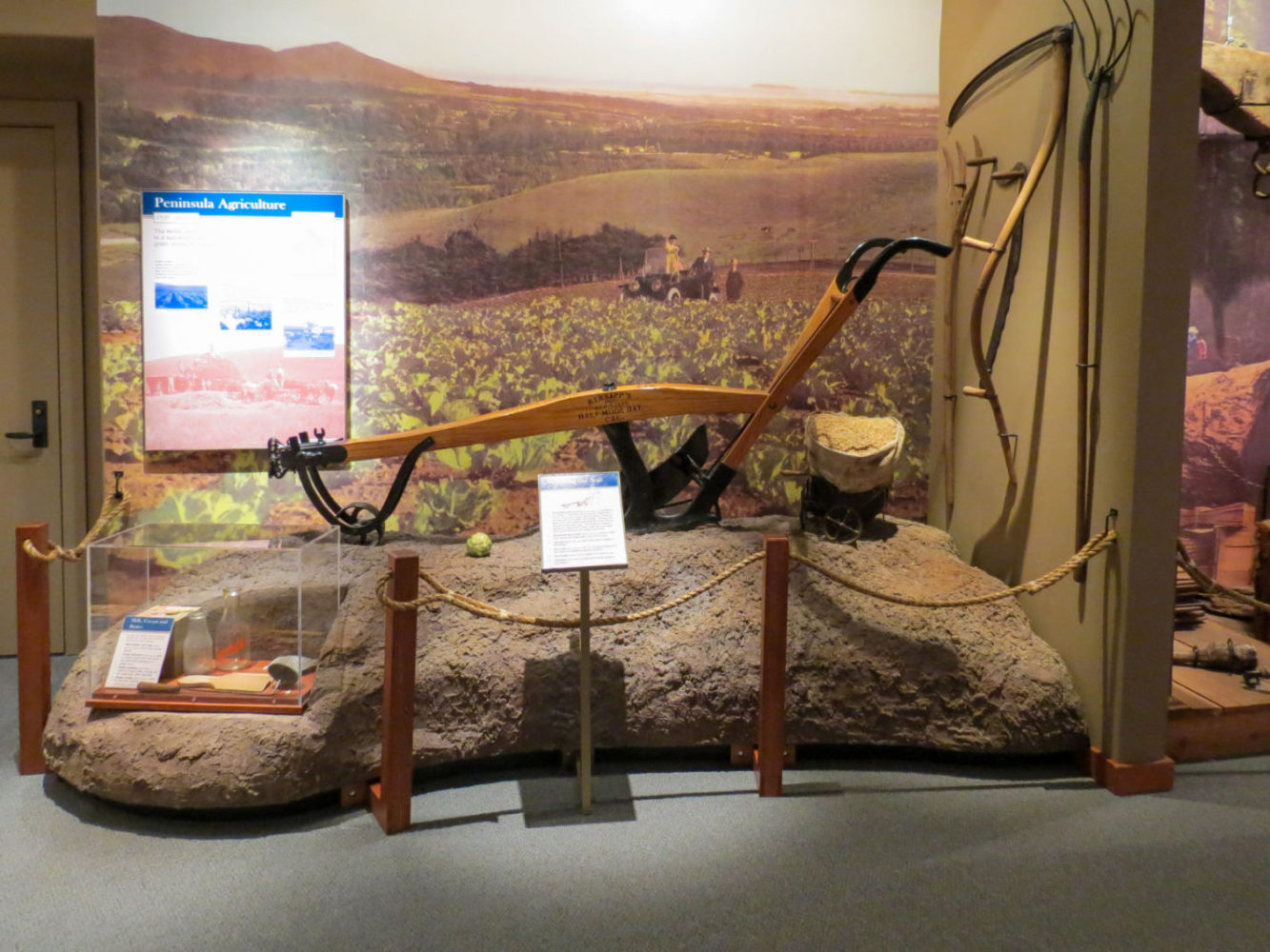 Exhibit display of farming equipment at Natures Bounty at the San Mateo County History Museum