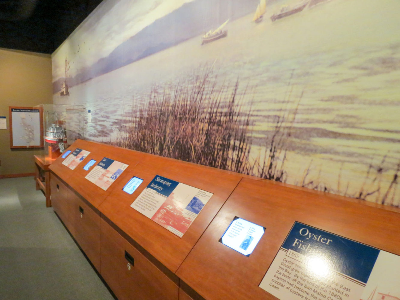 Interactive exhibit display screens at Natures Bounty at the San Mateo County History Museum