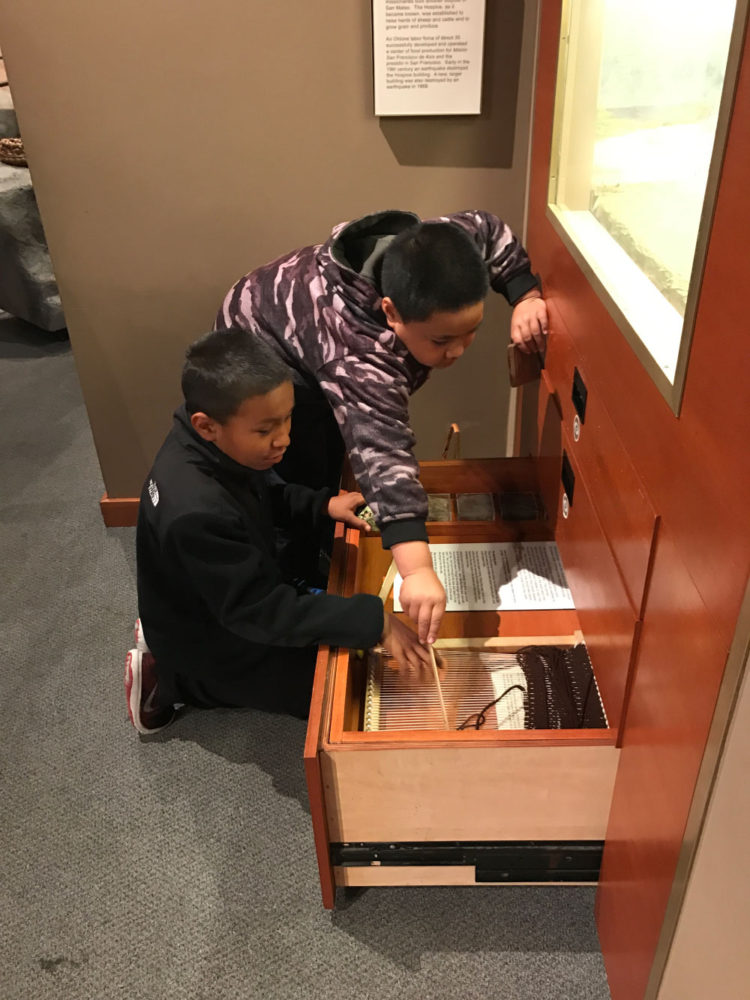 Students explore an interactive display at Providing Plenty school program at the San Mateo County History Museum