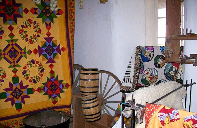 A variety of quilts on display at the Sanchez Adobe Quilt Show