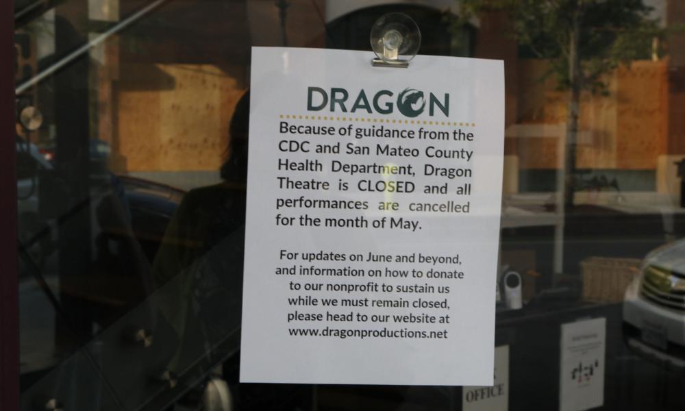 Sign posted to Dragon Theatre stating it is closed due to COVID 19