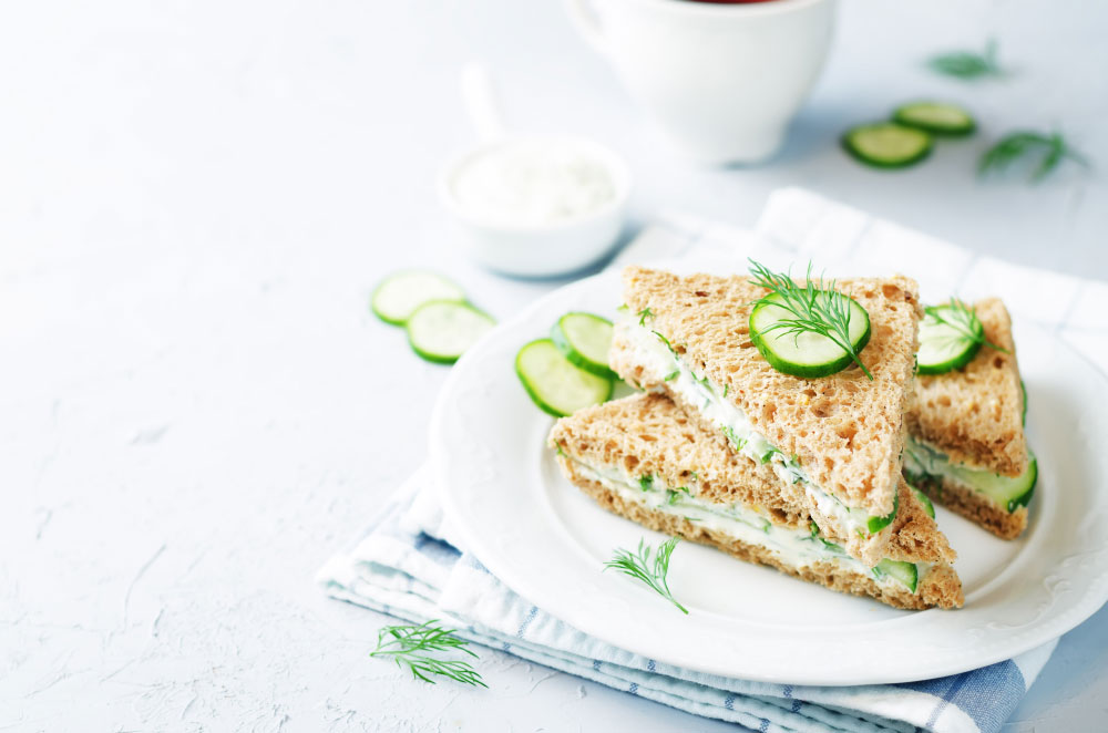 Cream cheese dill cucumber english tea sandwich on a plate