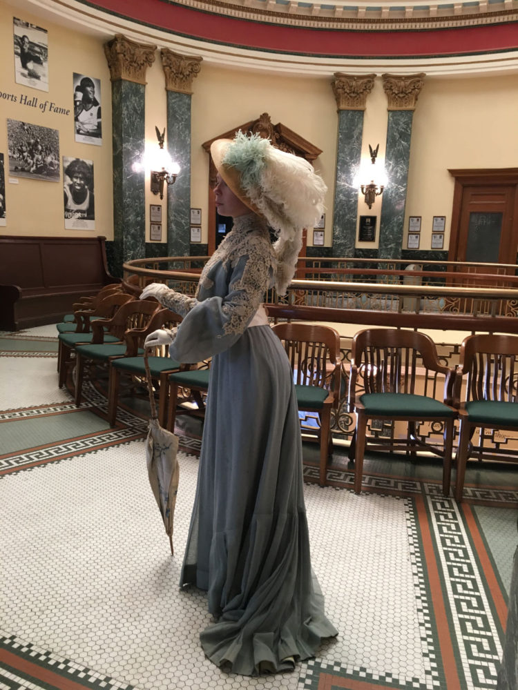 A young woman dressed in Victorian dress at San Mateo County History Museum