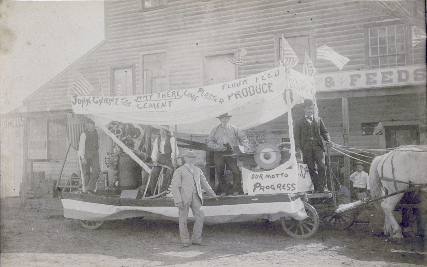 John Christ and his Fourth of July Float advertising his store