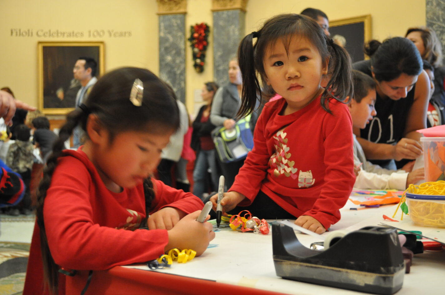Kids creating a holiday craft at the San Mateo County History Museum