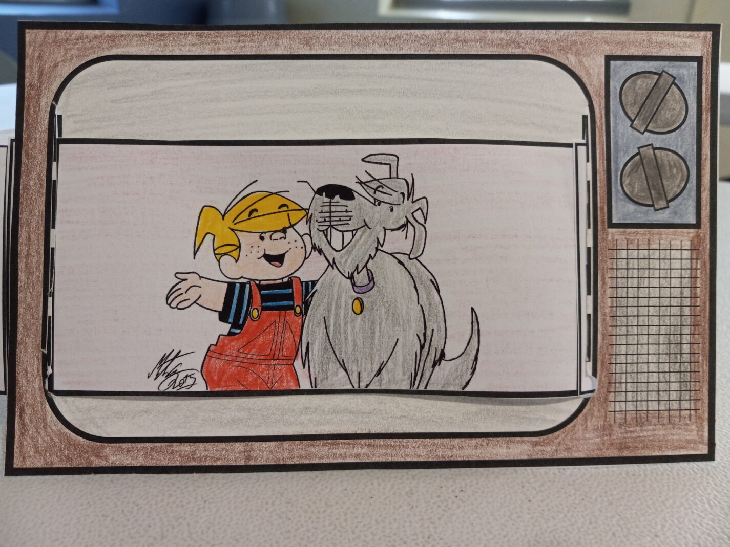 paper tv with picture of Dennis the Menace