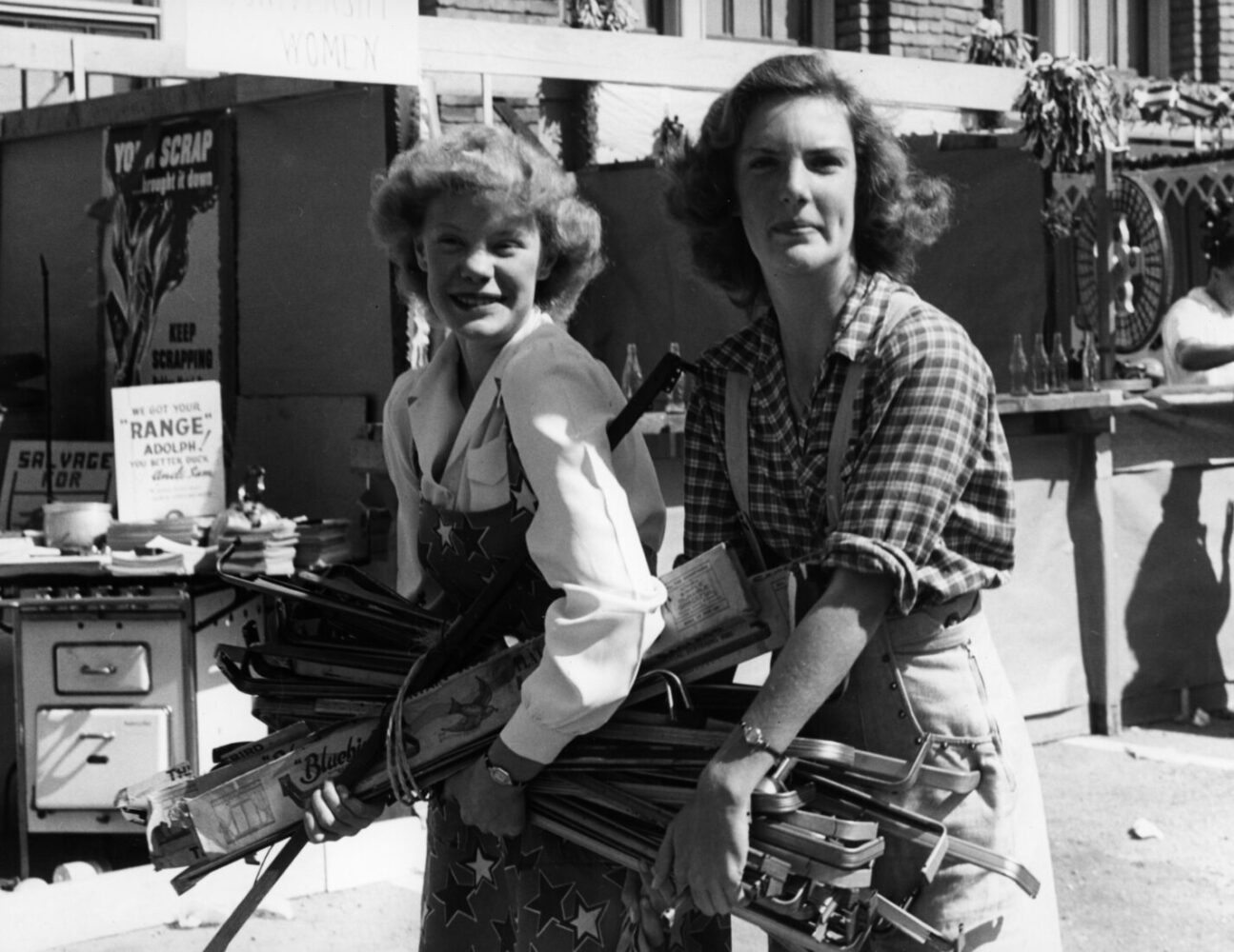 Two Women Carrying Scrap during World War II