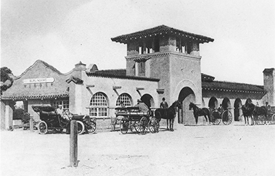 Burlingame Train station in 1903 with both a car and horse drawn vehicles