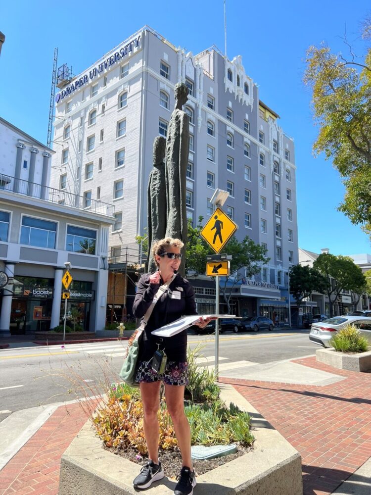 Tour guide in front of Draper University the former Benjamin Franklin hotel