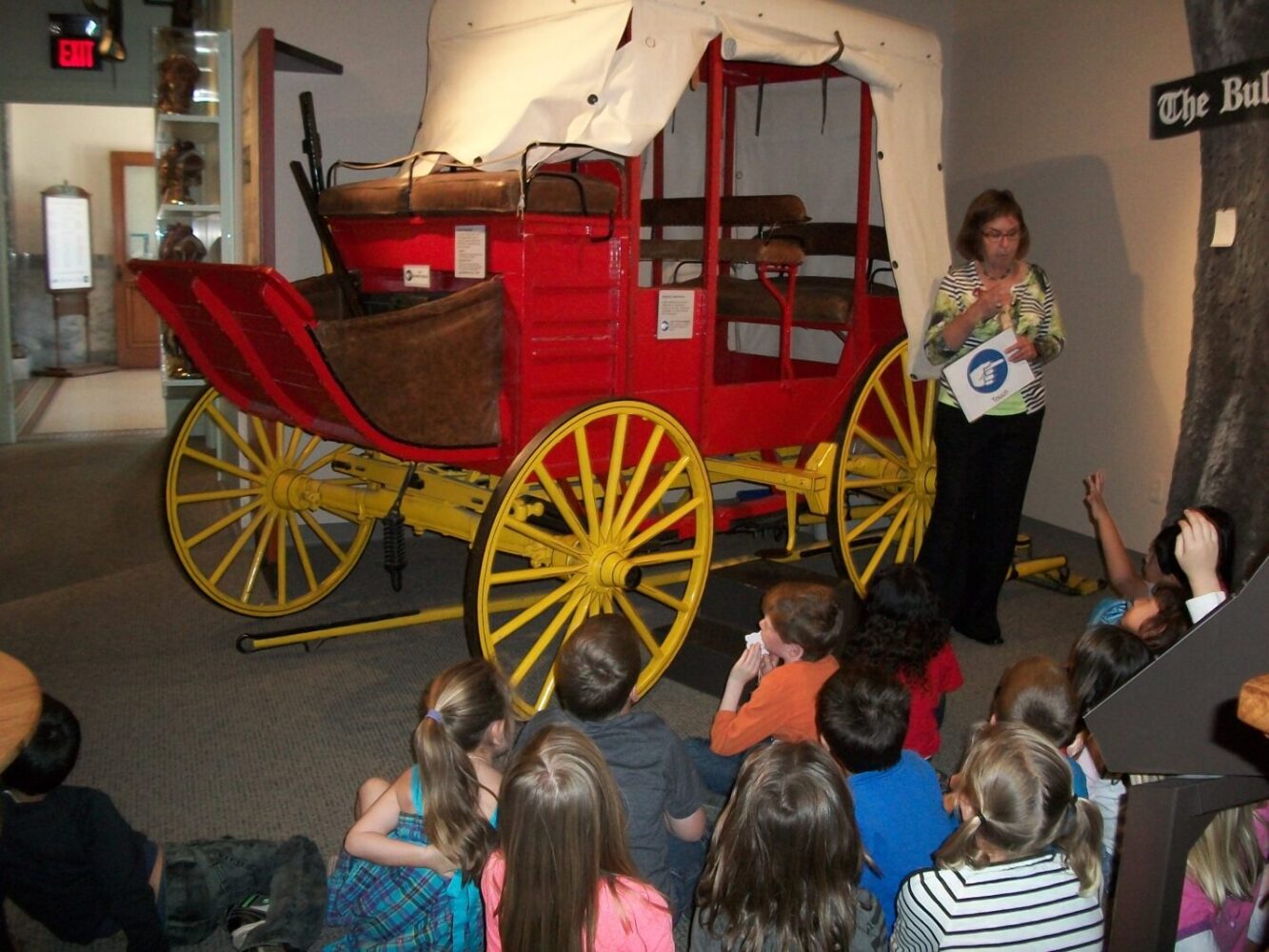 Docent with class at stagecoach