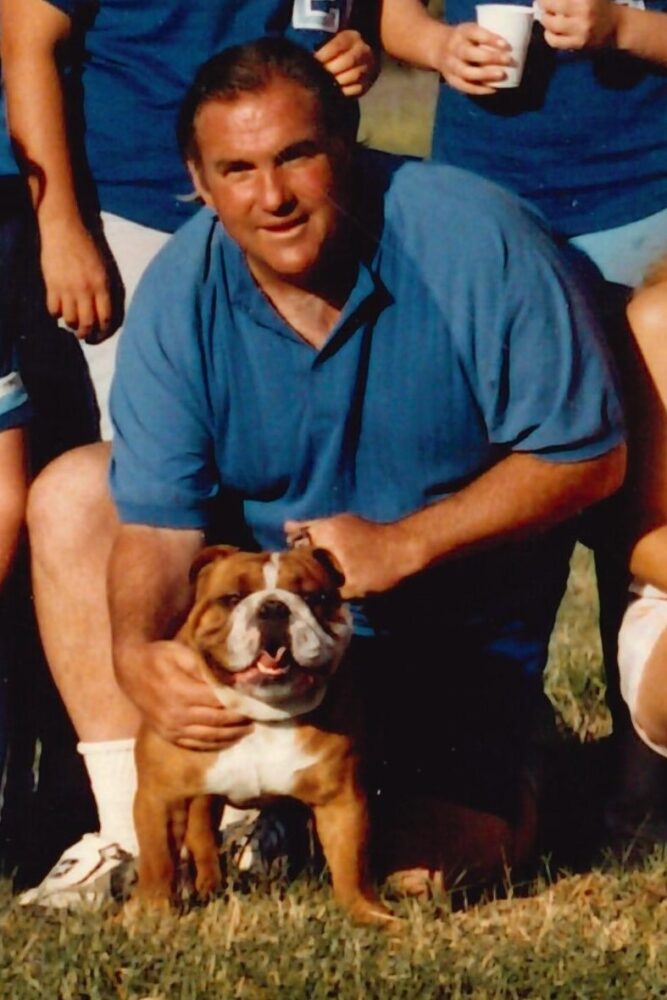 Coach Tom Martinez with bulldog